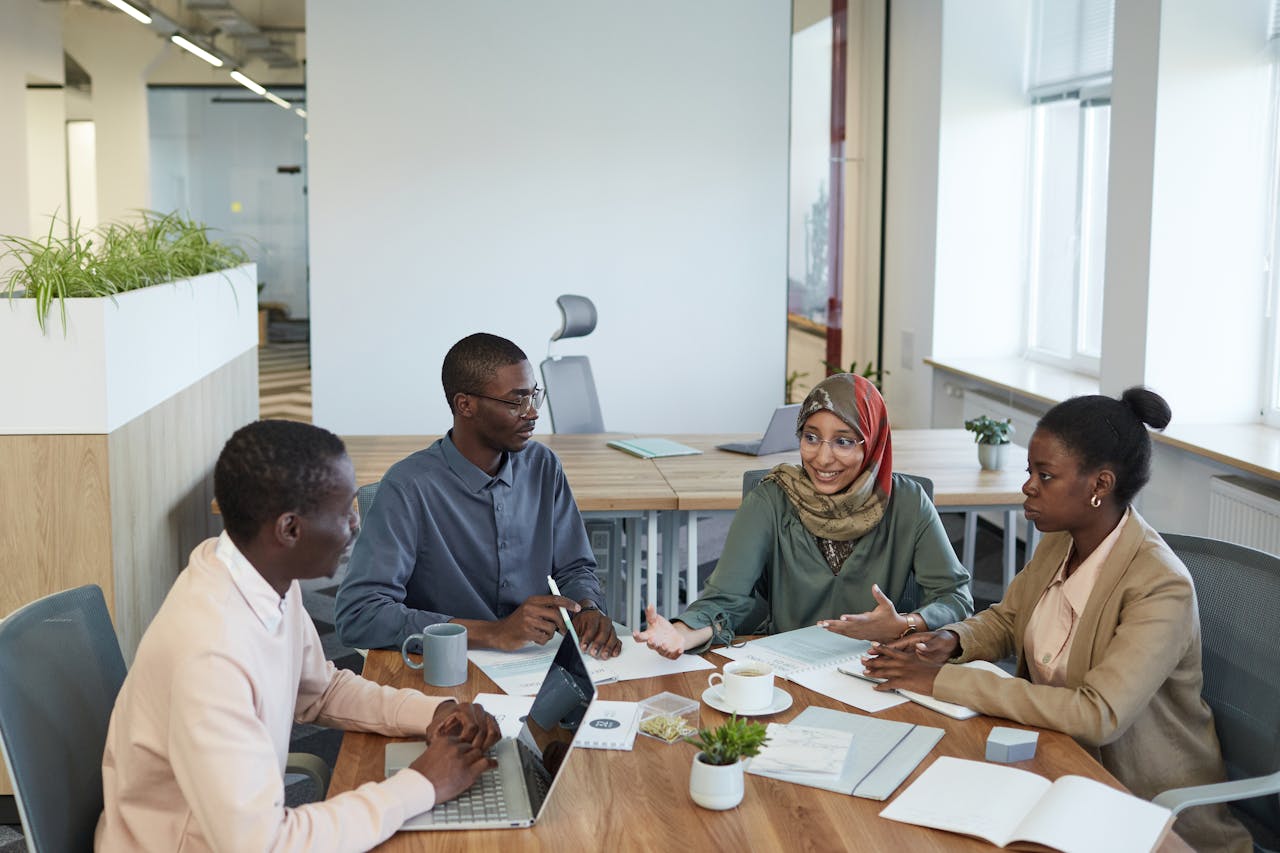 Crafting Captivating Headlines: Your awesome post title goes here A diverse group of professionals engaging in a productive meeting in a contemporary office space.